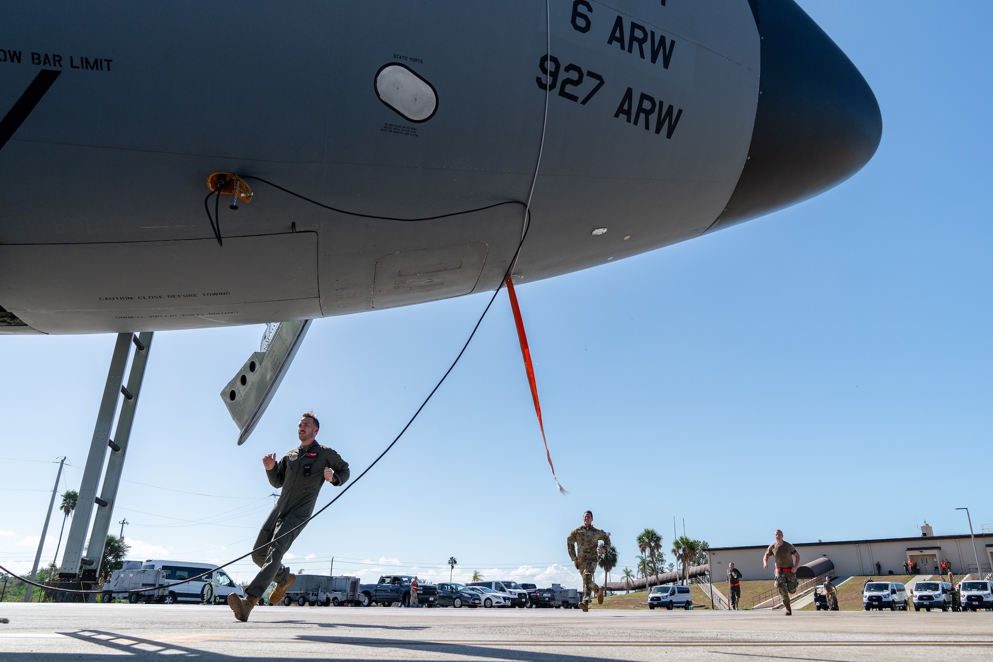 Airmen assigned to the 6th Air Refueling Wing run toward a KC-135 Stratotanker aircraft during a nuclear operational readiness exercise at MacDill Air Force Base, Florida, Nov. 5, 2022. The 6th ARW conducted the NORE to ensure proficiency and emergency response time of various units on base. (U.S. Air Force photo by Airman 1st Class Joshua Hastings)