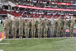 Soldiers who reenlisted during halftime at a UofL game