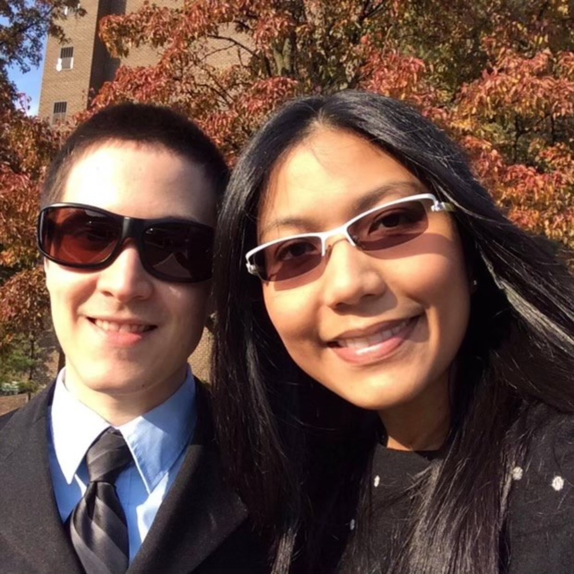 A couple pose for a photo.