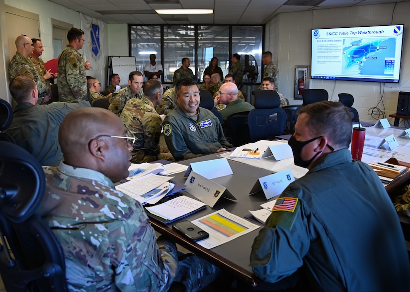 Col. Todd Randolph, 316th Wing and installation commander (left), Col. Roland Tsui, 459th Air Refueling Wing vice commander (center), and Col. Matthew Jones, 89th Airlift Wing commander (right), discuss the Joint Base Andrews Snow and Ice Plan during a tabletop exercise at JBA, Md., Nov. 7, 2022.. The exercise was utilized to ensure that all mission partners understood their roles and responsibilities for the upcoming winter season. (U.S. Air Force photo by Airman 1st Class Isabelle Churchill)