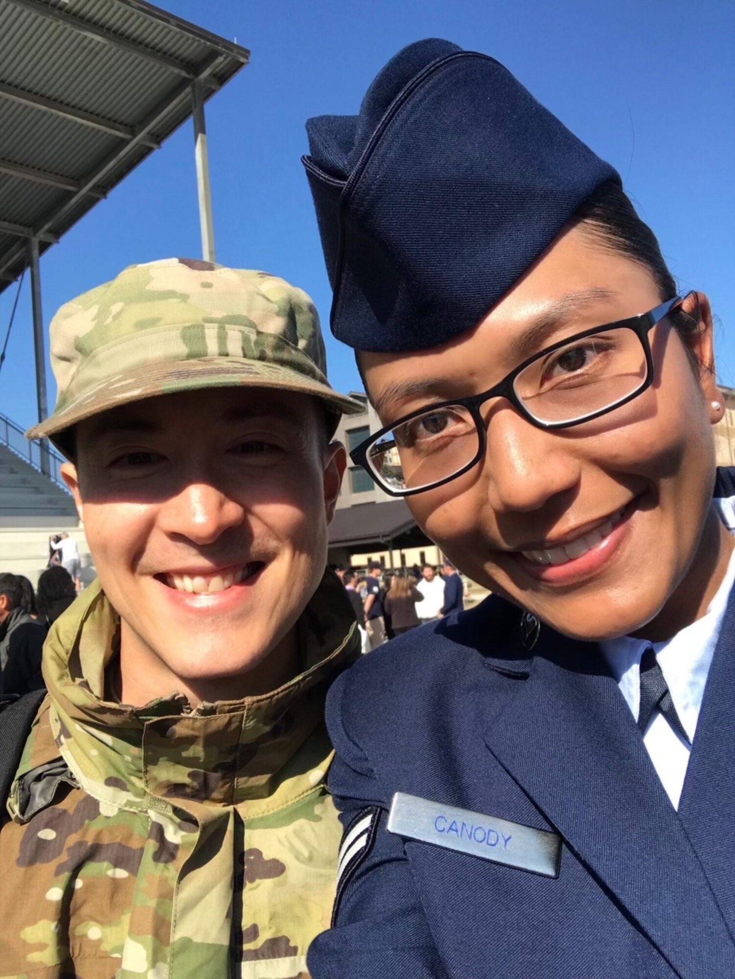 Airmen in uniform pose for a photo.