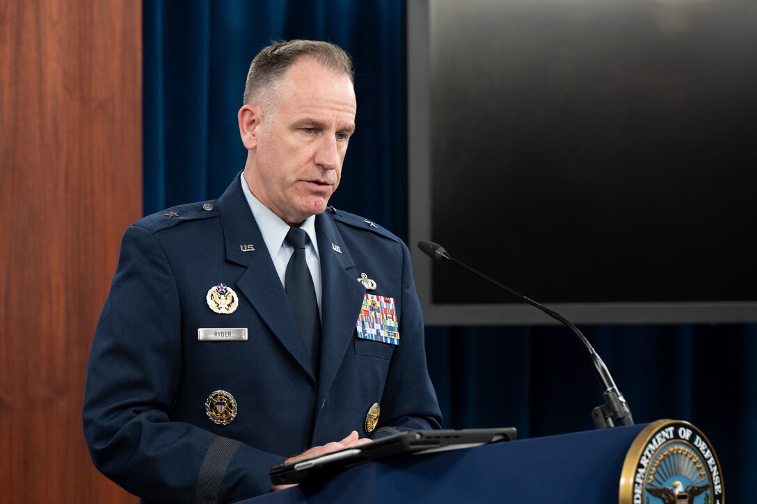 A man speaks from a podium.