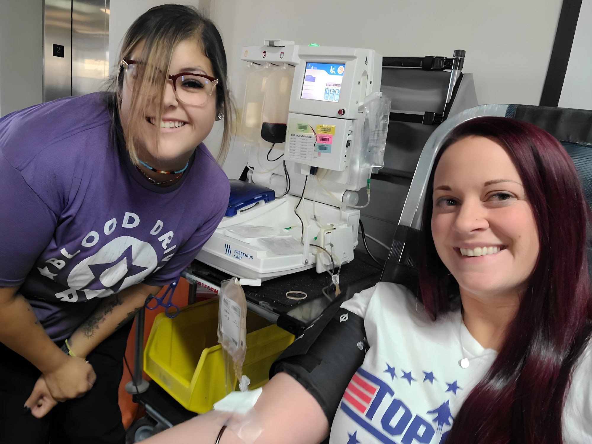 phlebotomist and donor pose for photo