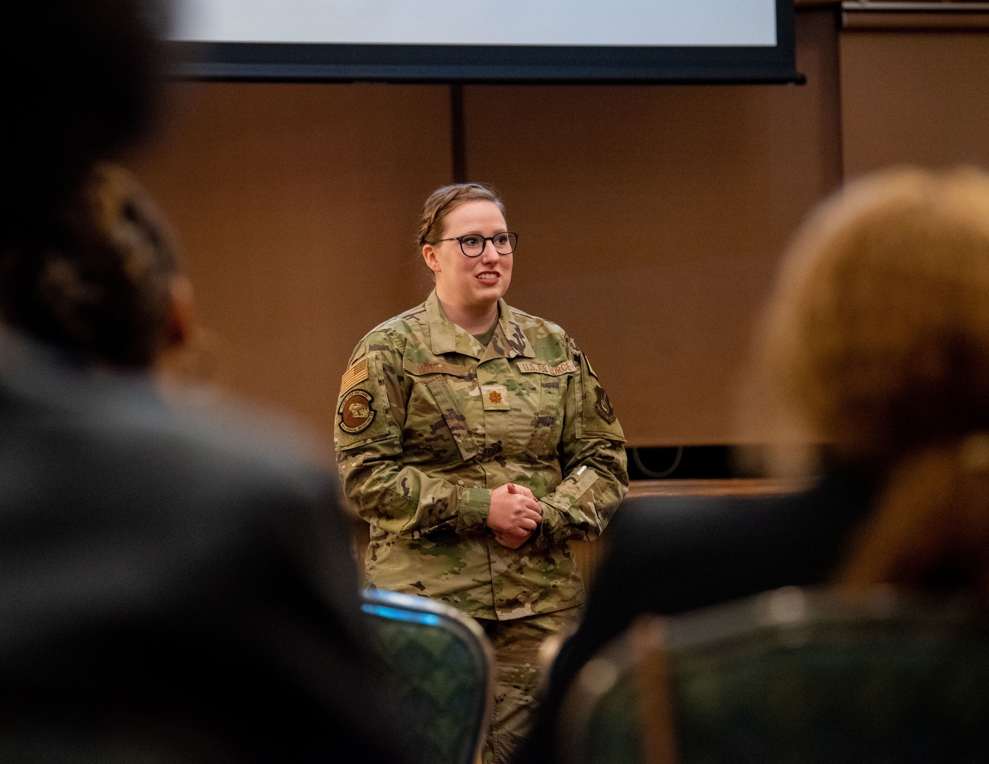 U.S. Air Force Maj. Justine Wells, 35th Surgical Operations Squadron labor and delivery element leader, shares her story during a Story Tellers event at Misawa Air Base, Japan, Oct. 19, 2022.