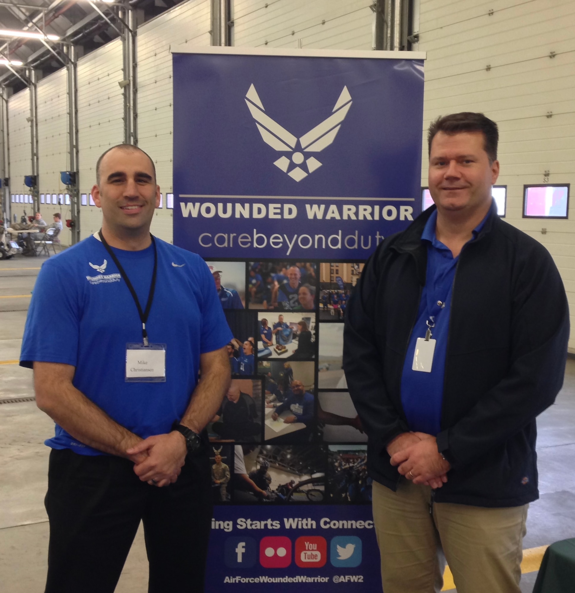 U.S. Air Force Master Sgt. (ret) Mike Christensen, left, and Senior Master Sgt. (ret.) Beau Jones, recovery care coordinator, represent the Air Force Wounded Warrior Program  as part of and event with a local amputee charity at Royal Air Force Mildenhall in 2016. Christensen has been an Air Force Wounded Warrior since 2011. The two retired senior NCOs shared information about the AFW2 program and how it can help wounded warriors. The purpose of AFW2 is to assist Airmen with either a full return to duty,  or transition into civilian/veteran life for those unable to return to active-duty service.  The program advocates for Airmen to minimise gaps in medical care and provides a broader support network and resiliency tools for both personal and professional growth. (Courtesy photo)