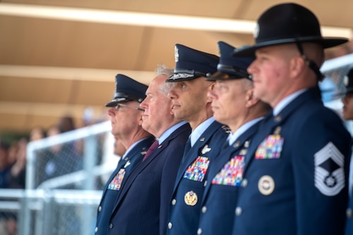 The Secretary of the Air Force stands alongside Basic Military Training leaders at graduation.
