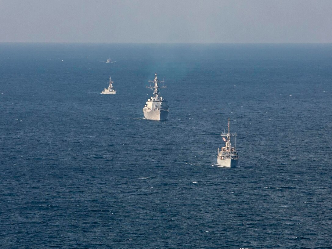 221104-N-UL352-1605 ARABIAN GULF (Nov. 4, 2022) Mine countermeasure ship USS Devastator (MCM 6), front, and guided-missile destroyer USS Delbert D. Black (DDG 119) sail in formation with Royal Saudi Naval Forces ships during exercise Nautical Defender in the Arabian Gulf, Nov. 4. The multilateral training event involved U.S. Naval Forces Central Command, Royal Saudi Navy’s Eastern Fleet and UK’s Royal Navy.