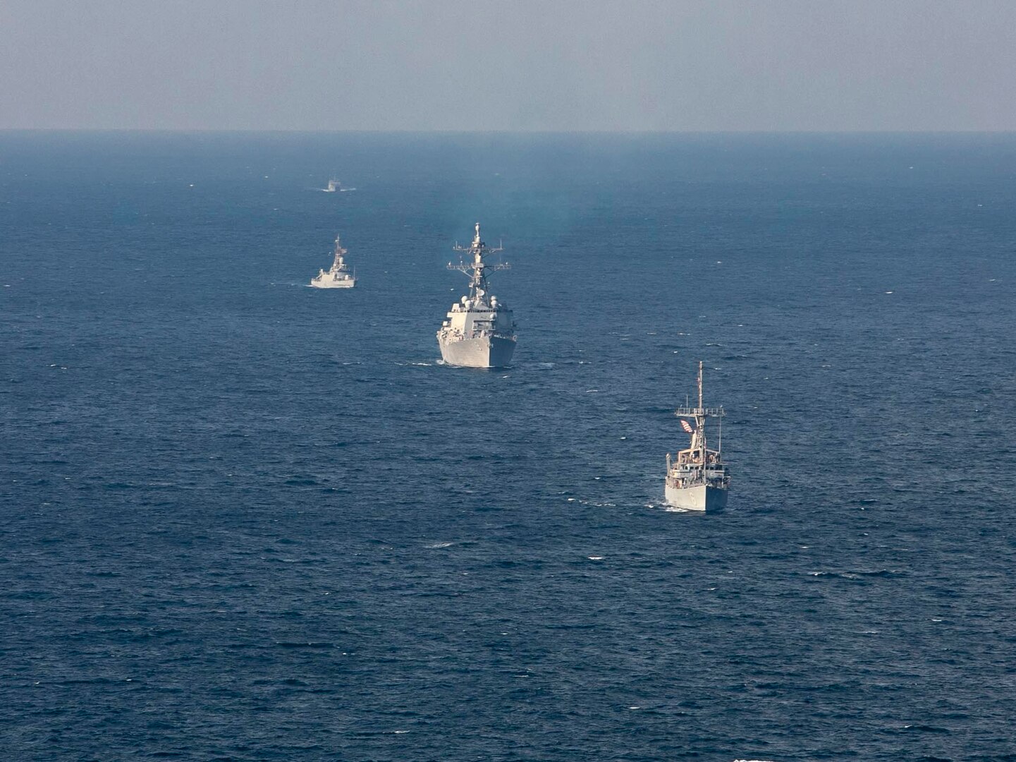 221104-N-UL352-1605 ARABIAN GULF (Nov. 4, 2022) Mine countermeasure ship USS Devastator (MCM 6), front, and guided-missile destroyer USS Delbert D. Black (DDG 119) sail in formation with Royal Saudi Naval Forces ships during exercise Nautical Defender in the Arabian Gulf, Nov. 4. The multilateral training event involved U.S. Naval Forces Central Command, Royal Saudi Navy’s Eastern Fleet and UK’s Royal Navy.