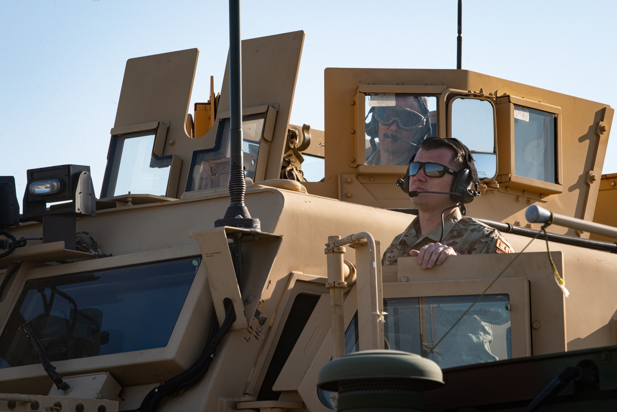 Gen. Ken Wilsbach, Pacific Air Forces commander, and Master Sgt. Kenneth Dunn, 51st Civil Engineer Squadron noncommissioned officer in charge of Explosive Ordnance Disposal flight, observes a sling load demonstration from a Mine-Resistant Ambush Protected (MRAP) vehicle at Osan Air Base, Republic of Korea, Nov. 4, 2022.