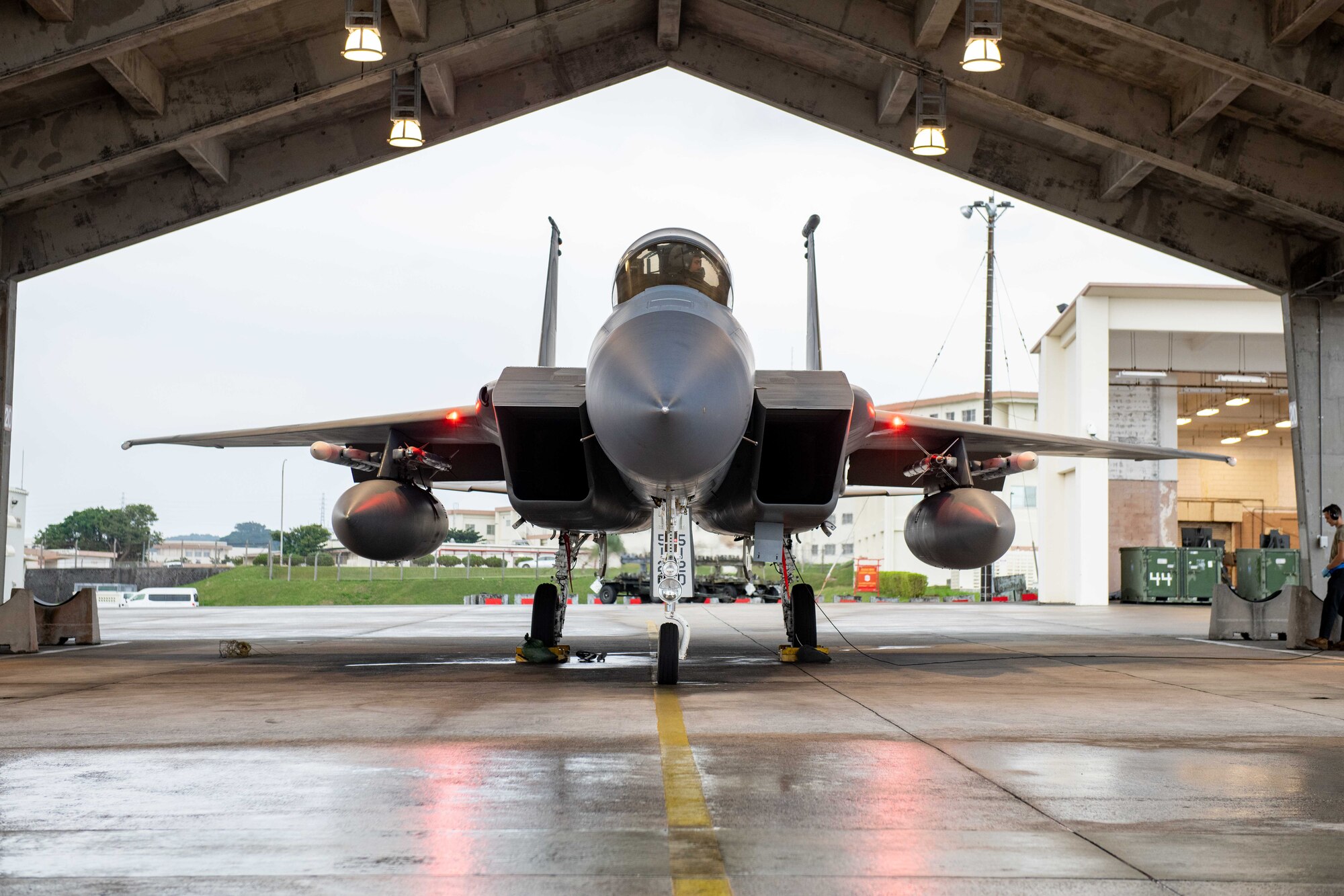 A fighter jet sits in a hangar
