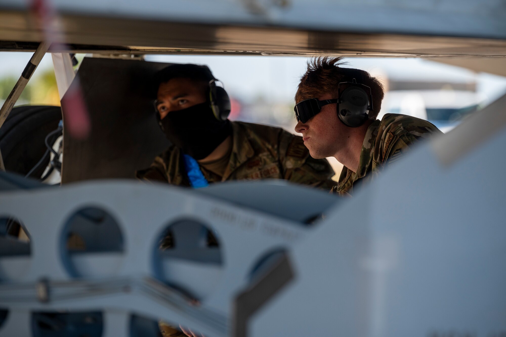 Airmen observe a missile load