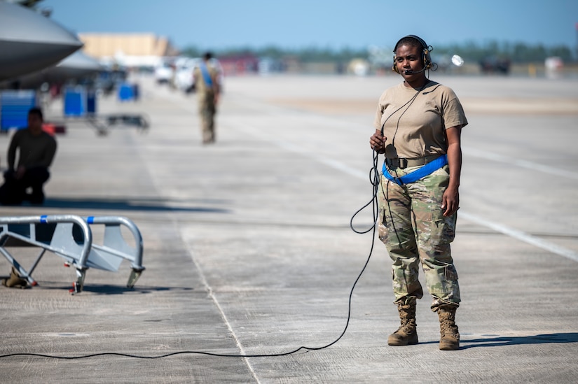 Airman stands on the flight line