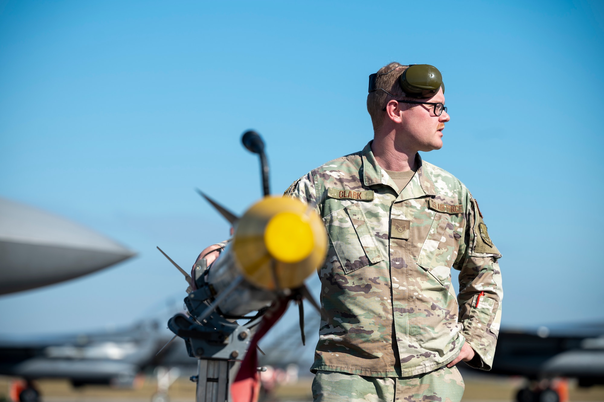 Airman secures a missile to a cart