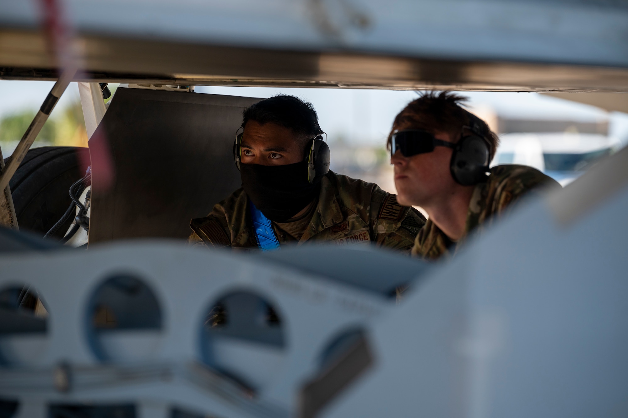Airmen observe a missile load