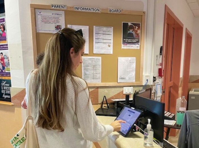 Parent signs out child with new system