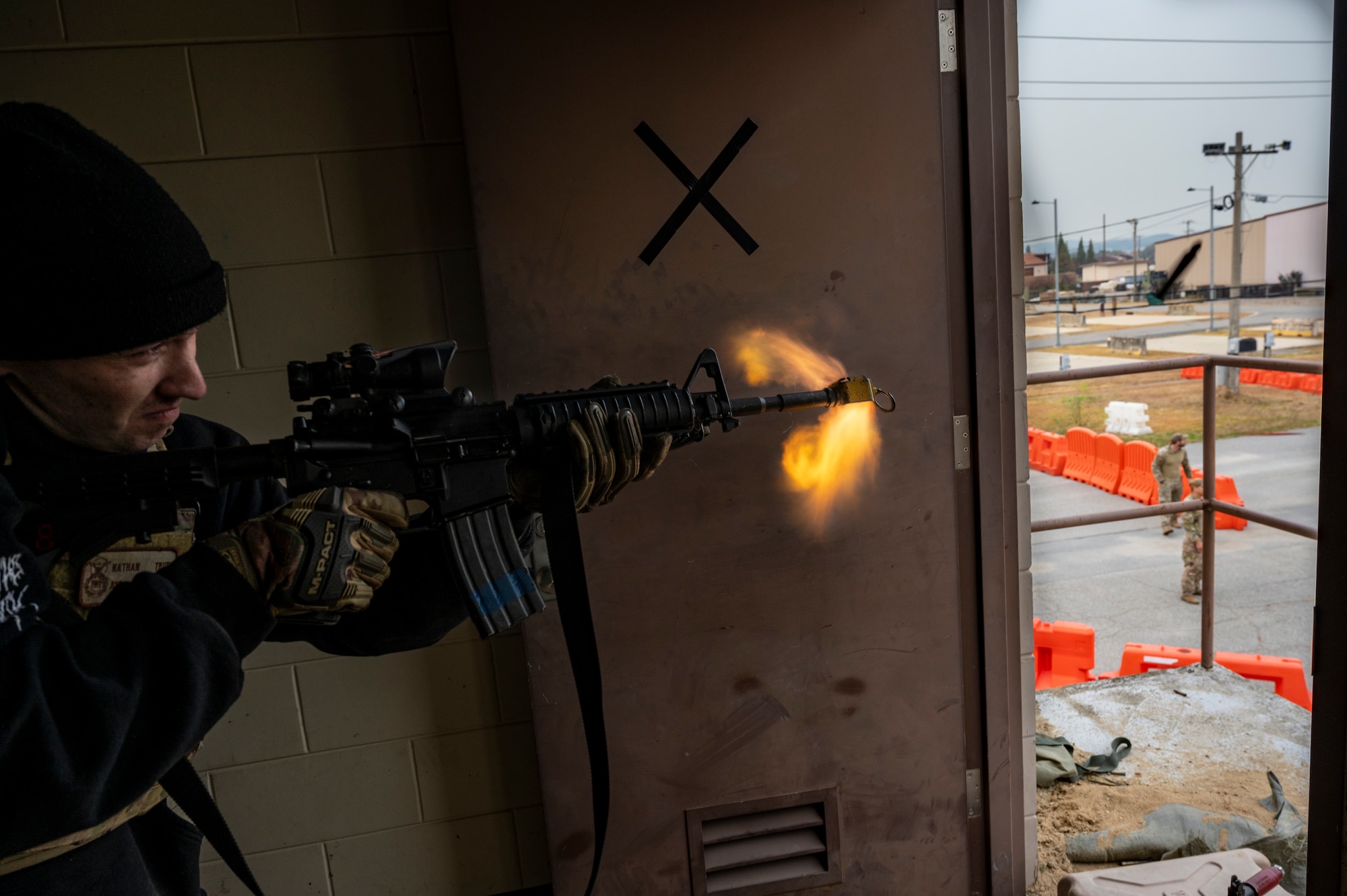 A U.S. Air Force 51st Security Forces Squadron Defender, fires blank rounds from an M4 Carbine rifle during a joint Combat Readiness Course (CRC) training with Republic of Korea Military Police members Osan Air Base, ROK, Nov. 3, 2022.