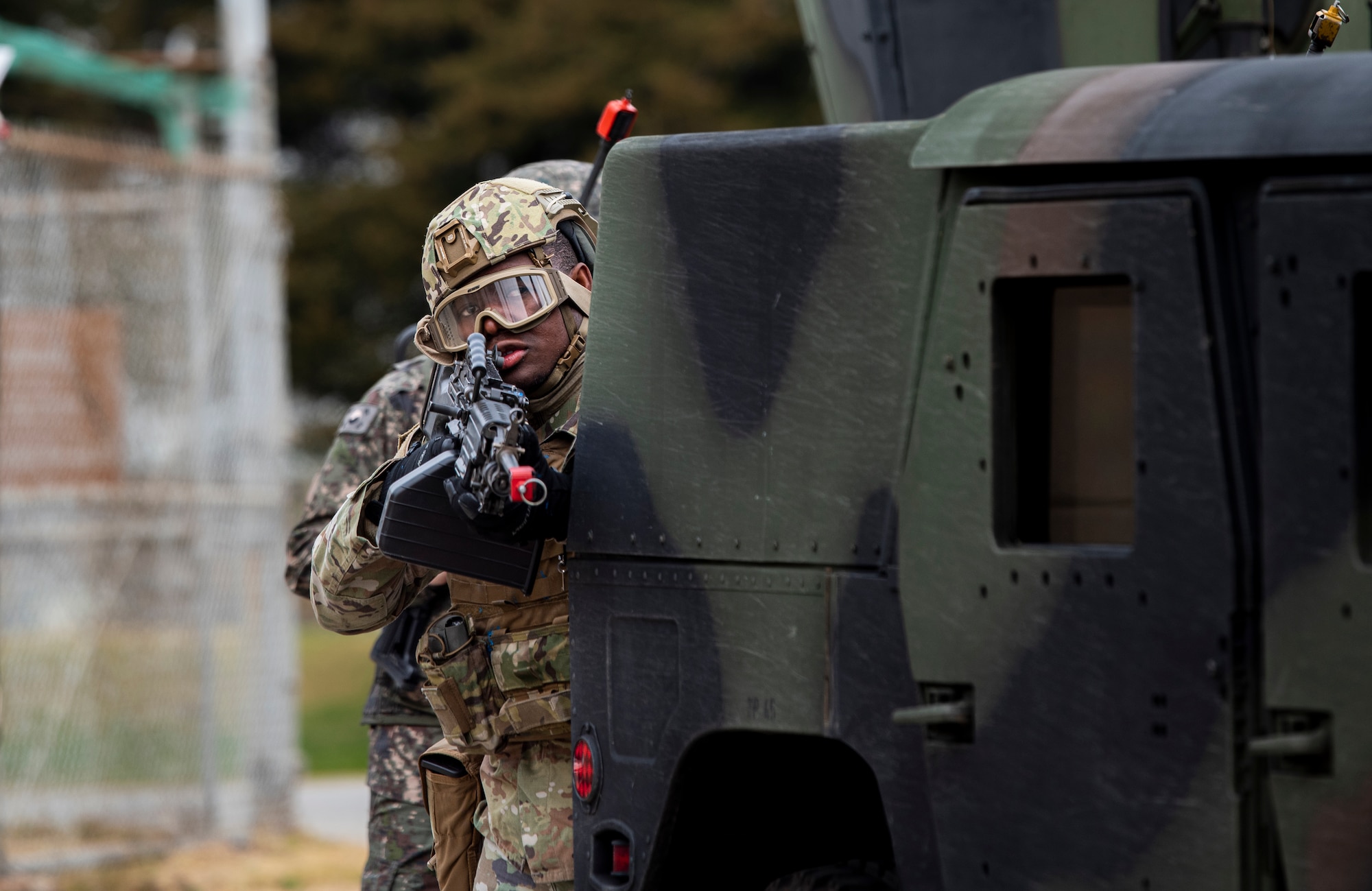 U.S. Air Force 51st Security Forces Squadron Defenders and Republic of Korea Military Policemen seek cover while responding to a simulated attack during a joint Combat Readiness Course at Osan Air Base, ROK, Nov. 3, 2022.