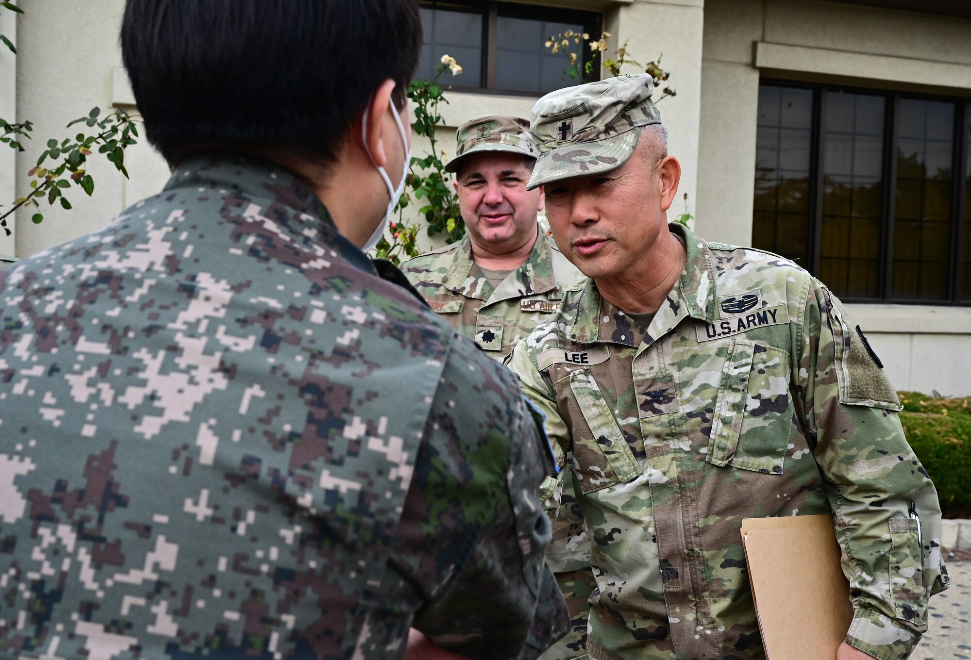 U.S. Army Chaplain (Col.) Sun Lee, U.S. Army Garrison Humphreys Garrison chaplain, greets Republic of Korea Air Forces Chaplain (Maj.) Lee, 38th Fighter Group wing chaplain, during Kunsan’s Inaugural Clergy Day at Kunsan Air Base, Republic of Korea, Nov. 8, 2022. The Wolf Pack’s first clergy day event included a luncheon with various denominations and religions, familiarizing local spiritual leaders with the wing’s chapel team. (U.S. Air Force photo by Staff Sgt. Sadie Colbert)
