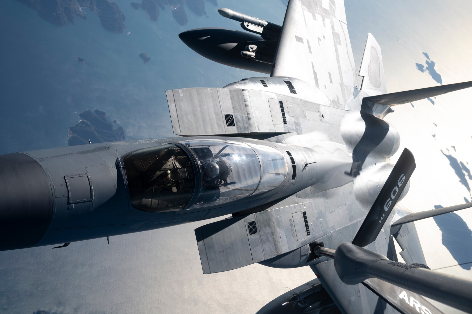 A U.S. Air Force 44th Fighter Squadron F-15C Eagle receives fuel from a 909th Air Refueling Squadron KC-135 Stratotanker over South Korea, Nov. 4, 2022. Kadena's F-15's  were the first operational Eagles outfitted with an active electronically-scanned array radar, and the Legion Pod, the first infrared search-and-track system compatible with the aircraft. (U.S. Air Force photo by Senior Airman Jessi Roth)