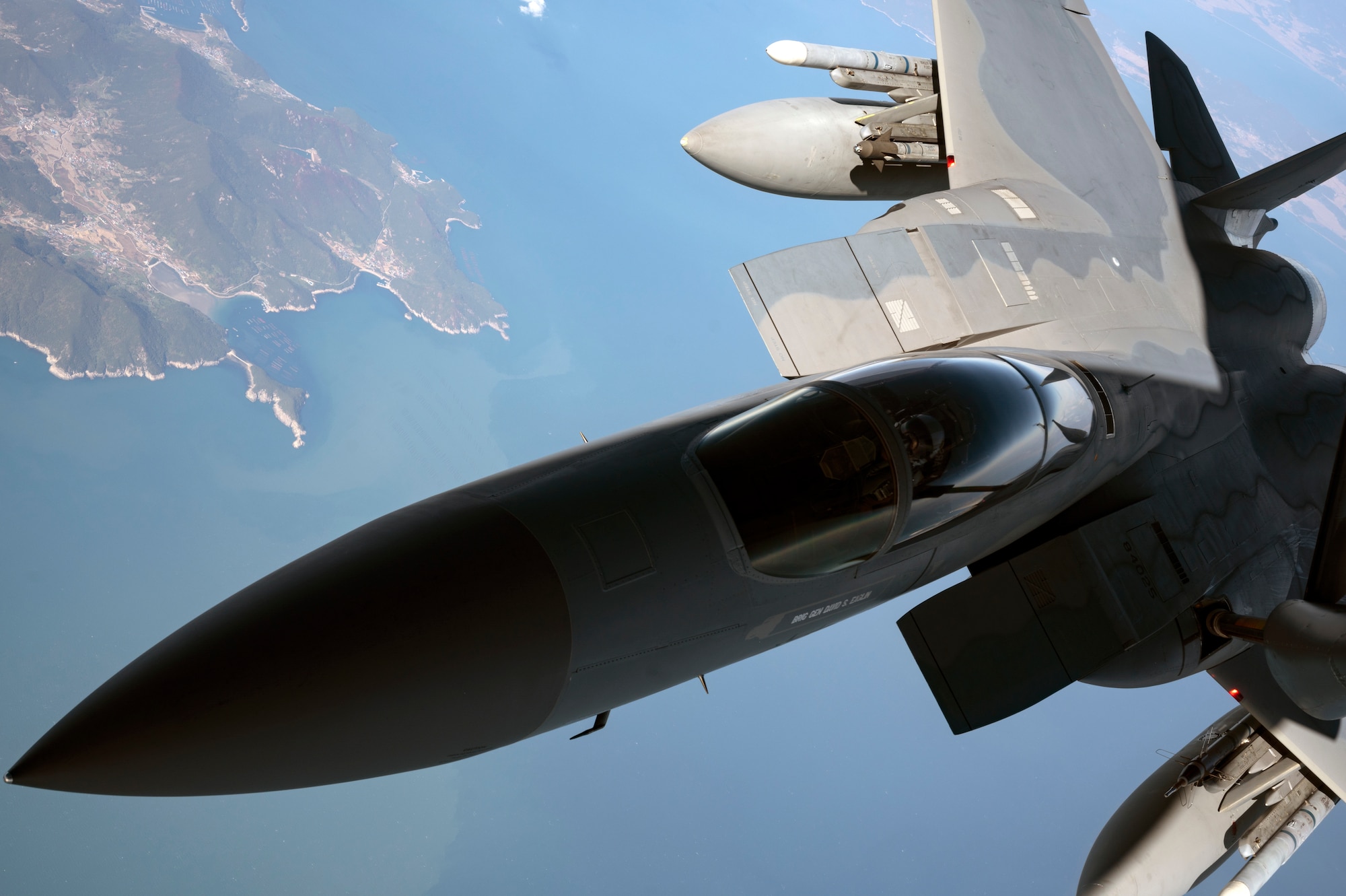 A U.S. Air Force 44th Fighter Squadron F-15C Eagle receives fuel from a 909th Air Refueling Squadron KC-135 Stratotanker over South Korea, Nov. 4, 2022. Kadena's F-15's  were the first operational Eagles outfitted with an active electronically-scanned array radar, and the Legion Pod, the first infrared search-and-track system compatible with the aircraft. (U.S. Air Force photo by Senior Airman Jessi Roth)