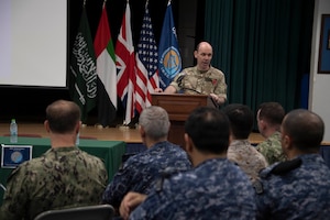 MANAMA, Bahrain (Nov. 8, 2022) United Kingdom Royal Navy Commodore Ben Aldous, commander of International Maritime Security Construct (IMSC) and Coalition Task Force Sentinel, speaks to military and industry representatives during IMSC’s biannual stakeholders conference in Bahrain, Nov. 8. The half-day conference included speakers and panelists who presented topics on maritime security, coalition and industry partnerships, and innovation.