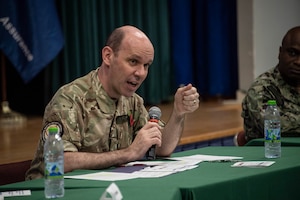 MANAMA, Bahrain (Nov. 8, 2022) United Kingdom Royal Navy Commodore Ben Aldous, commander of International Maritime Security Construct (IMSC) and Coalition Task Force Sentinel, speaks during IMSC’s biannual stakeholders conference in Bahrain, Nov. 8. The half-day conference included speakers and panelists who presented topics on maritime security, coalition and industry partnerships, and innovation.