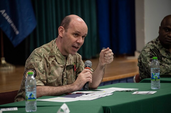 MANAMA, Bahrain (Nov. 8, 2022) United Kingdom Royal Navy Commodore Ben Aldous, commander of International Maritime Security Construct (IMSC) and Coalition Task Force Sentinel, speaks during IMSC’s biannual stakeholders conference in Bahrain, Nov. 8. The half-day conference included speakers and panelists who presented topics on maritime security, coalition and industry partnerships, and innovation.