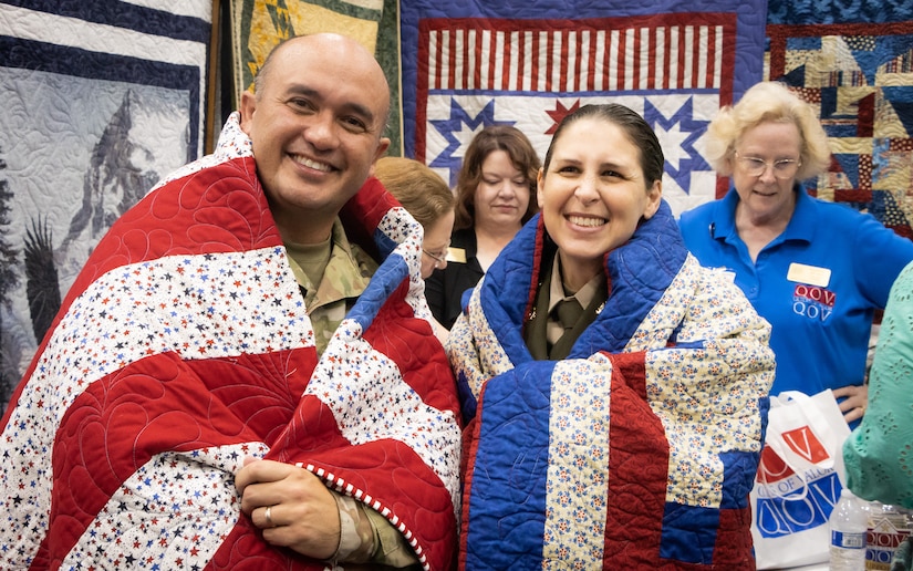 Some Heroes Wear Quilts: Army Reserve Soldier recognized by Quilts of Valor during International Quilting Festival