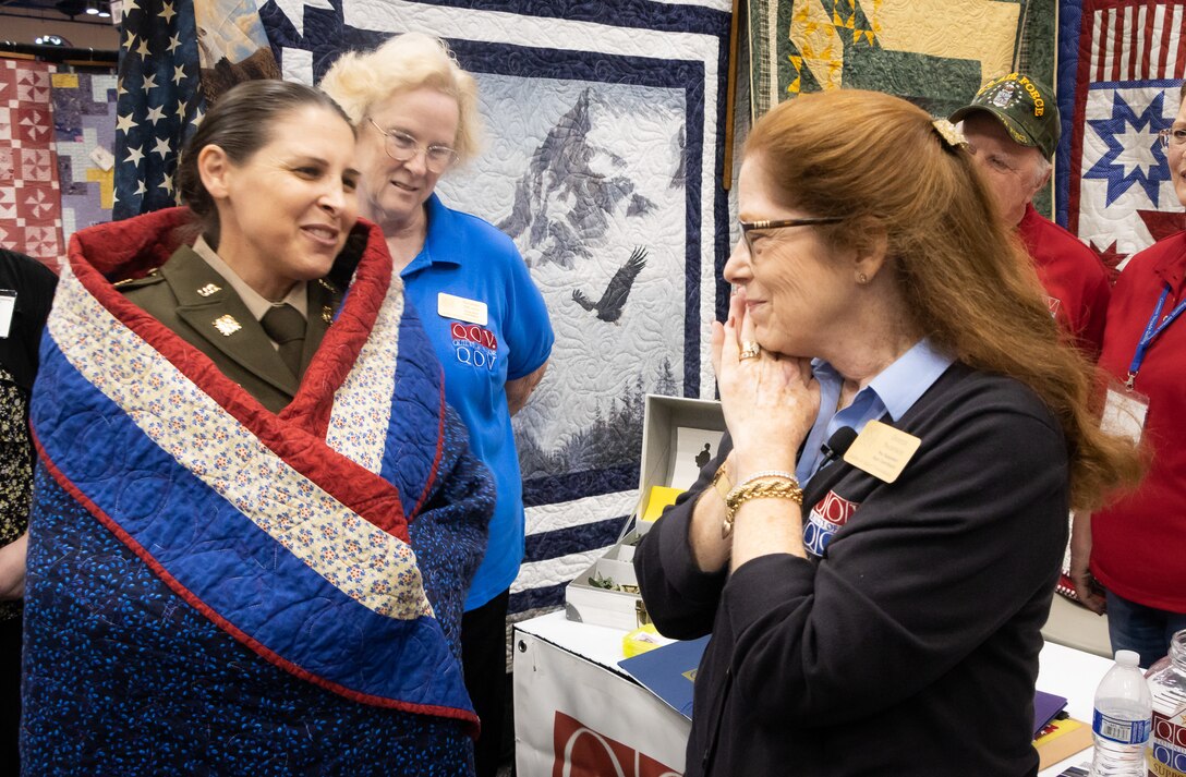 Some Heroes Wear Quilts: Army Reserve Soldier recognized by Quilts of Valor during International Quilting Festival