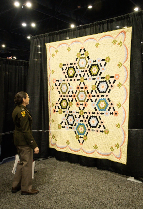 Some Heroes Wear Quilts: Army Reserve Soldier recognized by Quilts of Valor during International Quilting Festival