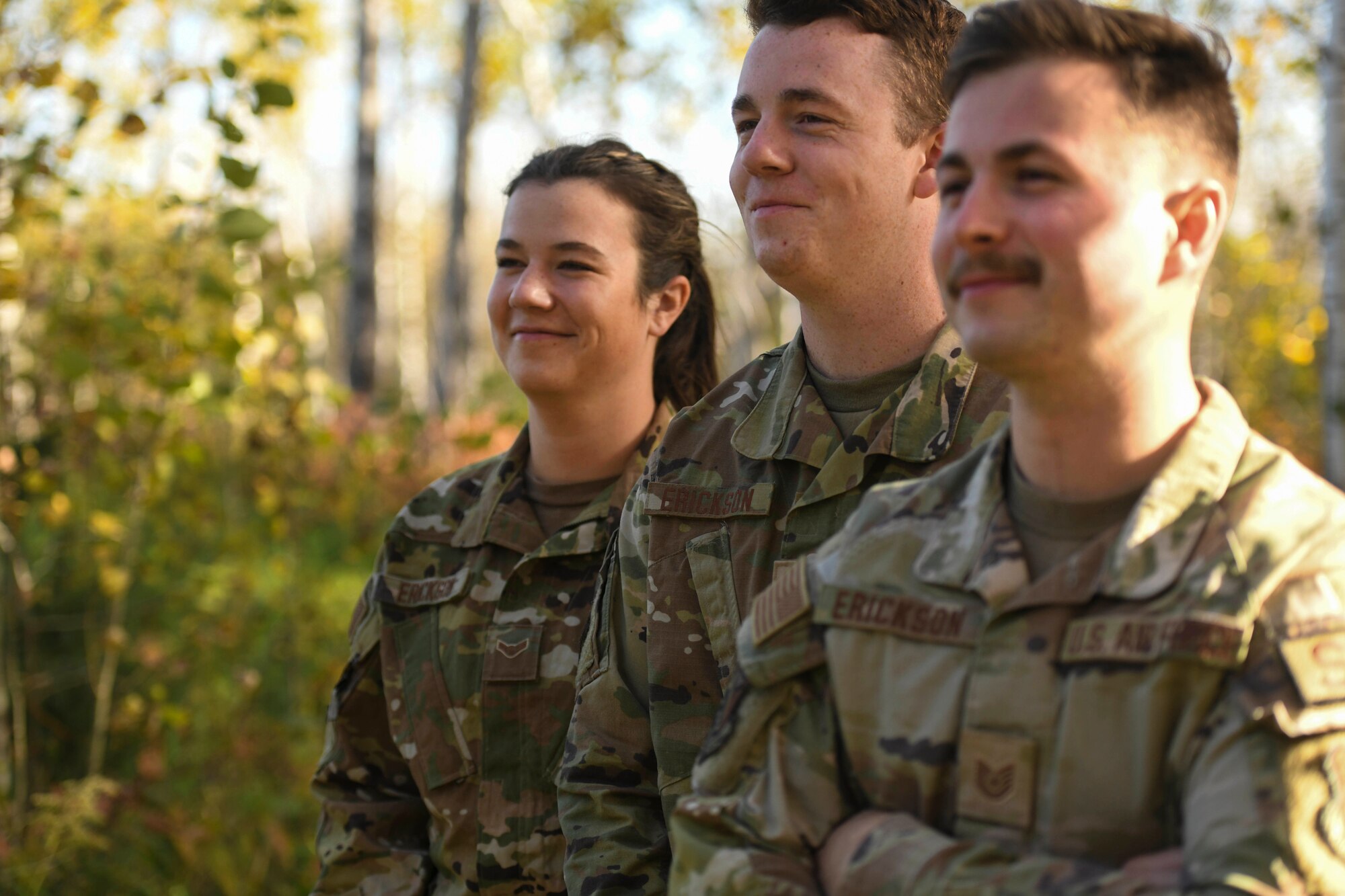 Tech. Sgt. Reid Erickson, Staff Sgt. Caden Erickson and Airman 1st Class Rylie Erickson pose for a picture, Oct. 7, 2022. The three siblings are all members of the 148th Fighter Wing and have deployed overseas in the past year.