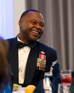Chief Master Sgt. Clifford Lawton, command chief of Joint Base Anacostia-Bolling and the 11th Wing smiles during the 75th Anniversary Air Force Ball hosted at Joint Base Anacostia-Bolling, Washington, D.C., Sept. 9, 2022. The Air Force was established through the National Security Act on Sept. 18, 1947. (U.S. Air Force photo by Airman Bill Guilliam)