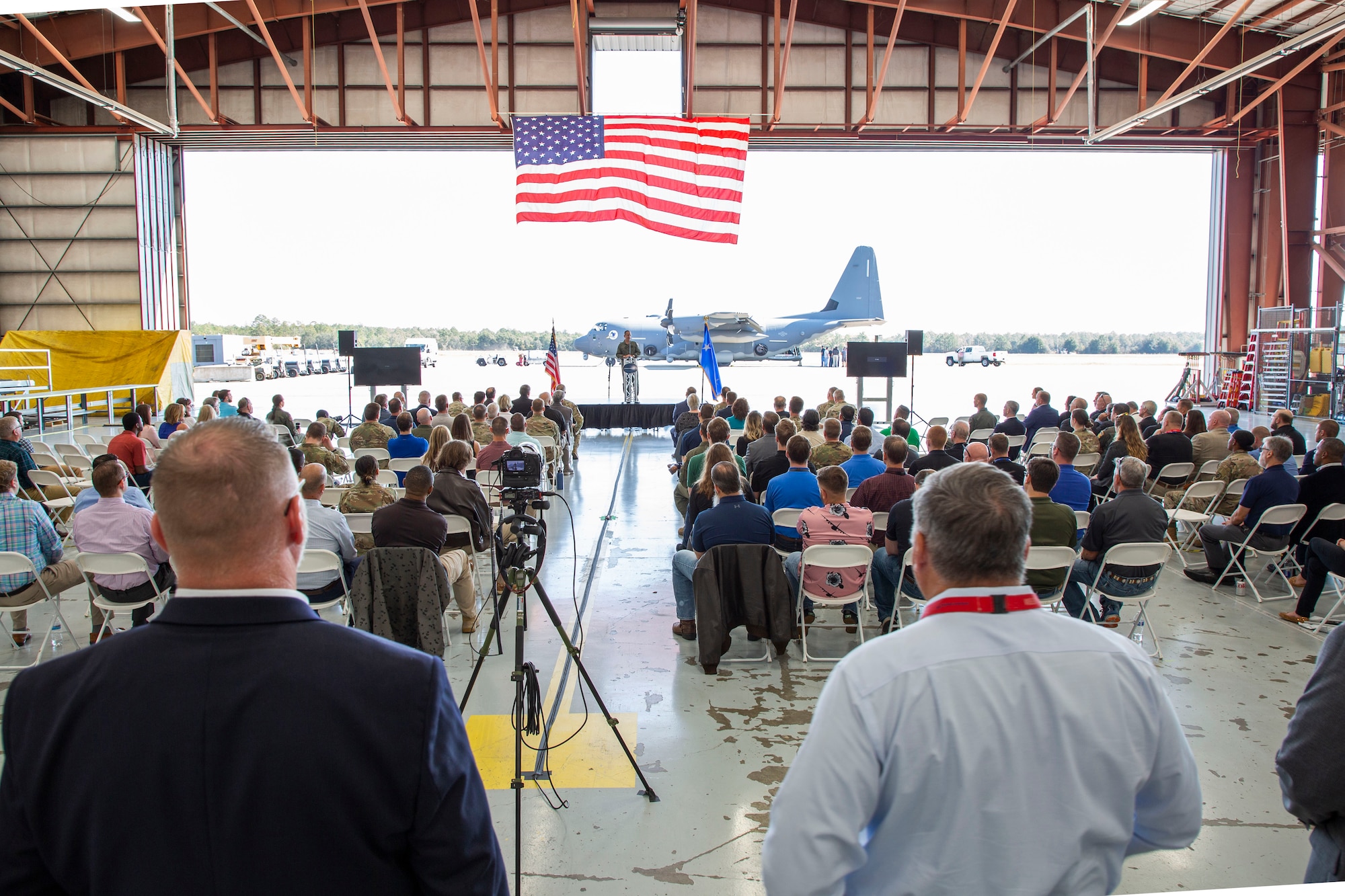 Attendees listen to remarks during the AC130J Ghostrider Dedication and Delivery Ceremony November 2nd 2022, at Bob Sikes Airport in Crestview, Florida. The aircraft, which was the final one delivered of the 31 purchased by the US Air Force, was nicknamed after Sluggo because of his instrumental work in the development of the aircraft’s precision strike package.