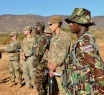U.S. Army Soldiers from 1st Battalion, 503rd Infantry Regiment, 173rd Airborne Brigade, meet with Kenyan Defence Force Soldiers to prepare for a bilateral exercise during Justified Accord, March 13, 2022. Exercise Justified Accord allows the United States and African partners to support peace and stability in the region.