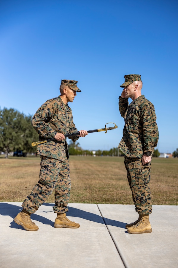 U.S. Marine Corps Lt. Col. William T. Kerrigan, commanding officer of 1st Battalion, 8th Marine Regiment, appoints Sgt. Maj. Daniel R. Lassett as the sergeant major of 1st Battalion, 8th Marine Regiment at Camp Lejeune, North Carolina, Nov. 8, 2022.