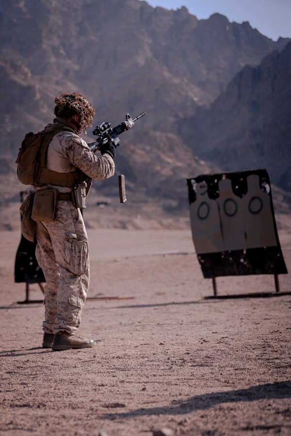 CAMP TITIN, Jordan – A U.S. Marine assigned to Fleet Anti-Terrorism Security Team Central Command (FASTCENT) conduct a close quarters marksmanship range during Exercise Eager Lion 22 at Camp Titin, Jordan, September 14, 2022. Eager Lion 22 is a multilateral exercise hosted by the Hashemite Kingdom of Jordan, designed to exchange military expertise, and improve interoperability among partner nations, and considered the capstone of a broader U.S. military relationship with the Jordanian Armed Forces (JAF). Jordan is one of U.S. Central Command’s (USCENTCOM) strongest and most reliable partners in the Levant sub-region. (U.S. Marine Corps photo by Cpl. Juan Carpanzano)