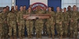 soldiers seated at tables with trophies