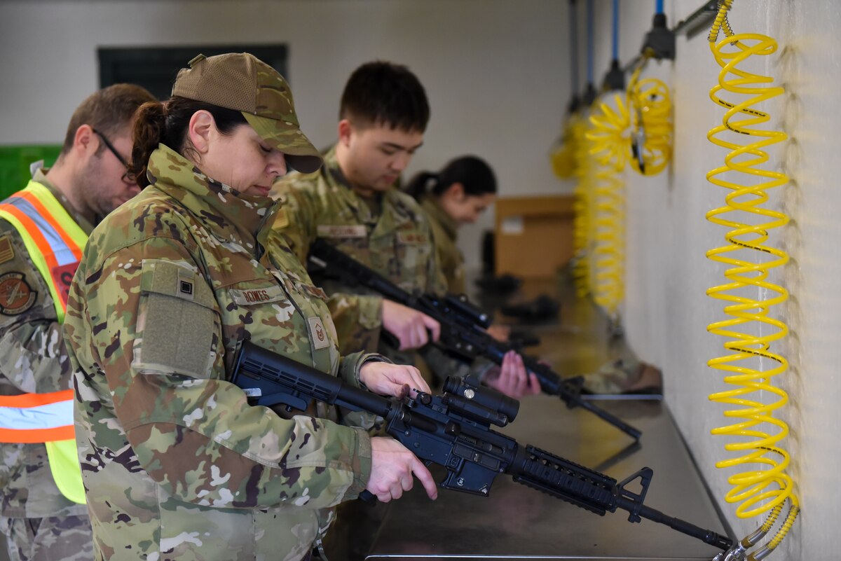 Master Sgt. Danica Bowes, clears a M4 Carbine as part of the 88th Air Base Wing readiness exercise, Wright-Patterson Air Force Base, Nov. 3, 2022. The Wing assessment evaluated basic Airman readiness skills to include Chemical, Biological, Radiation and Nuclear (CBRN) survival training, Tactical Combat Casualty Care (TCCC) training and M4 carbine weapons handling. (U.S. Air Force photo by Matthew Clouse)