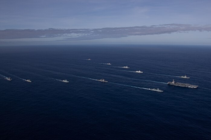 The first-in-class aircraft carrier USS Gerald R. Ford (CVN 78) steams in the Atlantic Ocean in formation with the German frigate FGS Hessen (F 221), the Ticonderoga-class guided-missile cruiser USS Normandy (CG 60), the Danish frigate HDMS Peter Willemoes (FFH 362), the Canadian frigate HMCS Montreal (FFH 336), the Arleigh Burke-class guided-missile destroyer USS Thomas Hudner (DDG 116), the Spanish Armada frigate Álvaro de Bazán (F 101), the Dutch frigate HNLMS De Zeven Povincien (F 802), the French frigate FS Chevalier Paul (D 621), the Dutch frigate HNLMS Van Amstel (F 831) and the Arleigh Burke-class guided-missile destroyer USS McFaul (DDG 74), Nov. 7, 2022. Exercise Silent Wolverine is a U.S.-led, combined training exercise that tests Ford-class aircraft carrier capabilities through integrated high-end naval warfare scenarios alongside participating allies in the Eastern Atlantic Ocean. The Gerald R. Ford Carrier Strike Group is conducting their first deployment in the U.S. Naval Forces Europe area of operations. (U.S. Navy photo by Mass Communication Specialist 2nd Class Jackson Adkins)