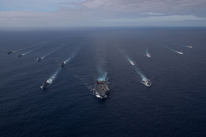 The first-in-class aircraft carrier USS Gerald R. Ford (CVN 78) steams in the Atlantic Ocean in formation with the German frigate FGS Hessen (F 221), the Ticonderoga-class guided-missile cruiser USS Normandy (CG 60), the Danish frigate HDMS Peter Willemoes (FFH 362), the Canadian frigate HMCS Montreal (FFH 336), the Arleigh Burke-class guided-missile destroyer USS Thomas Hudner (DDG 116), the Spanish Armada frigate Álvaro de Bazán (F 101), the Dutch frigate HNLMS De Zeven Povincien (F 802), the French frigate FS Chevalier Paul (D 621), the Dutch frigate HNLMS Van Amstel (F 831) and the Arleigh Burke-class guided-missile destroyer USS McFaul (DDG 74), Nov. 7, 2022. Exercise Silent Wolverine is a U.S.-led, combined training exercise that tests Ford-class aircraft carrier capabilities through integrated high-end naval warfare scenarios alongside participating allies in the Eastern Atlantic Ocean. The Gerald R. Ford Carrier Strike Group is conducting their first deployment in the U.S. Naval Forces Europe area of operations. (U.S. Navy photo by Mass Communication Specialist 2nd Class Jackson Adkins)