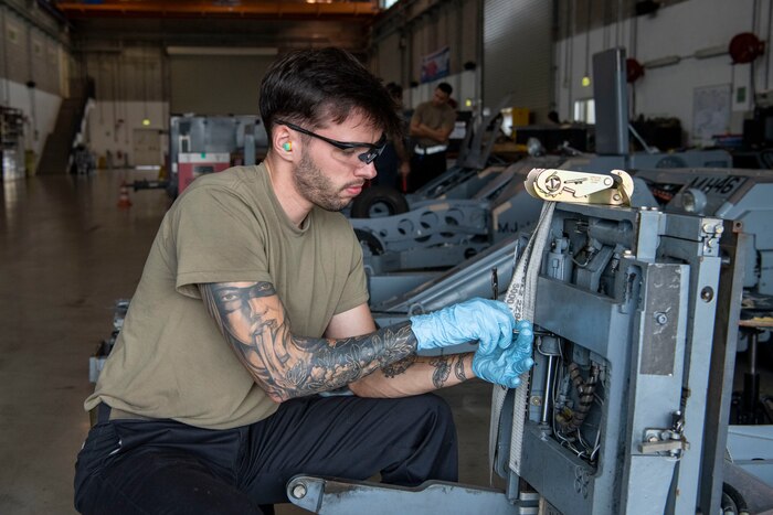 Senior Airman Devin Goodspeed, 31st Maintenance Squadron Aerospace Ground Equipment journeyman, maintains a bomb lift at Aviano Air Base, Italy, Oct. 24, 2022. The bomb lifts area a vital component at fighter wings as because they aid in the transport and loading of munitions onto fighter aircraft. (U.S. Air Force photo by Airman 1st Class Thomas Calopedis)