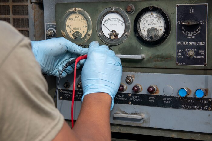 Senior Airman Danyel Pendleton, 31st Maintenance Squadron Aerospace Ground Equipment journeyman tests a generator electrical output at Aviano Air Base, Italy, Oct. 24, 2022. Pendleton reviewed technical data which provided clear and concise instructions for the maintenance and operation of Air Force equipment. (U.S. Air Force photo by Airman 1st Class Thomas Calopedis)