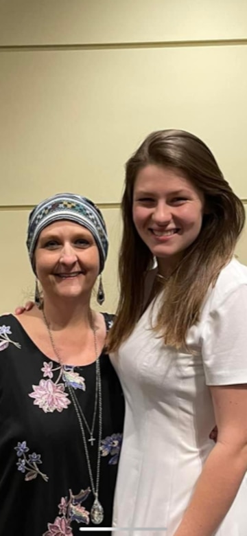 Tina Gatewood, Mobile District customer service representative, right, poses for a photo with her daughter Emily, Nov. 13, 2021, Mobile, Alabama. Gatewood is still working hard for the District despite her Stage IV colon cancer diagnosis. (Courtesy photo)