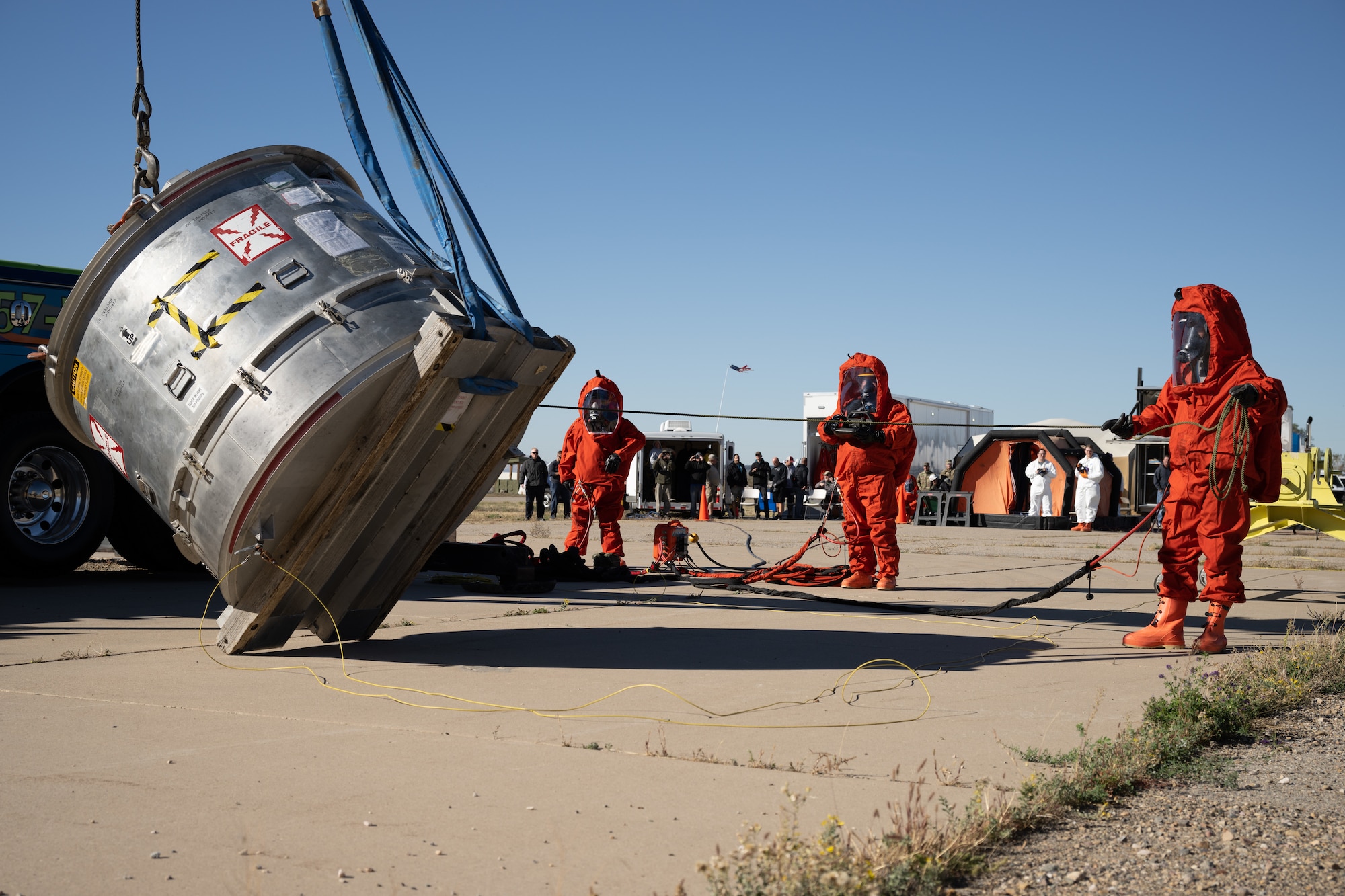 Members of the Missile Mishap Response Team upright an overturned Minuteman III weapon system component container during a training event at Hill Air Force Base, Utah, Oct. 4, 2022.