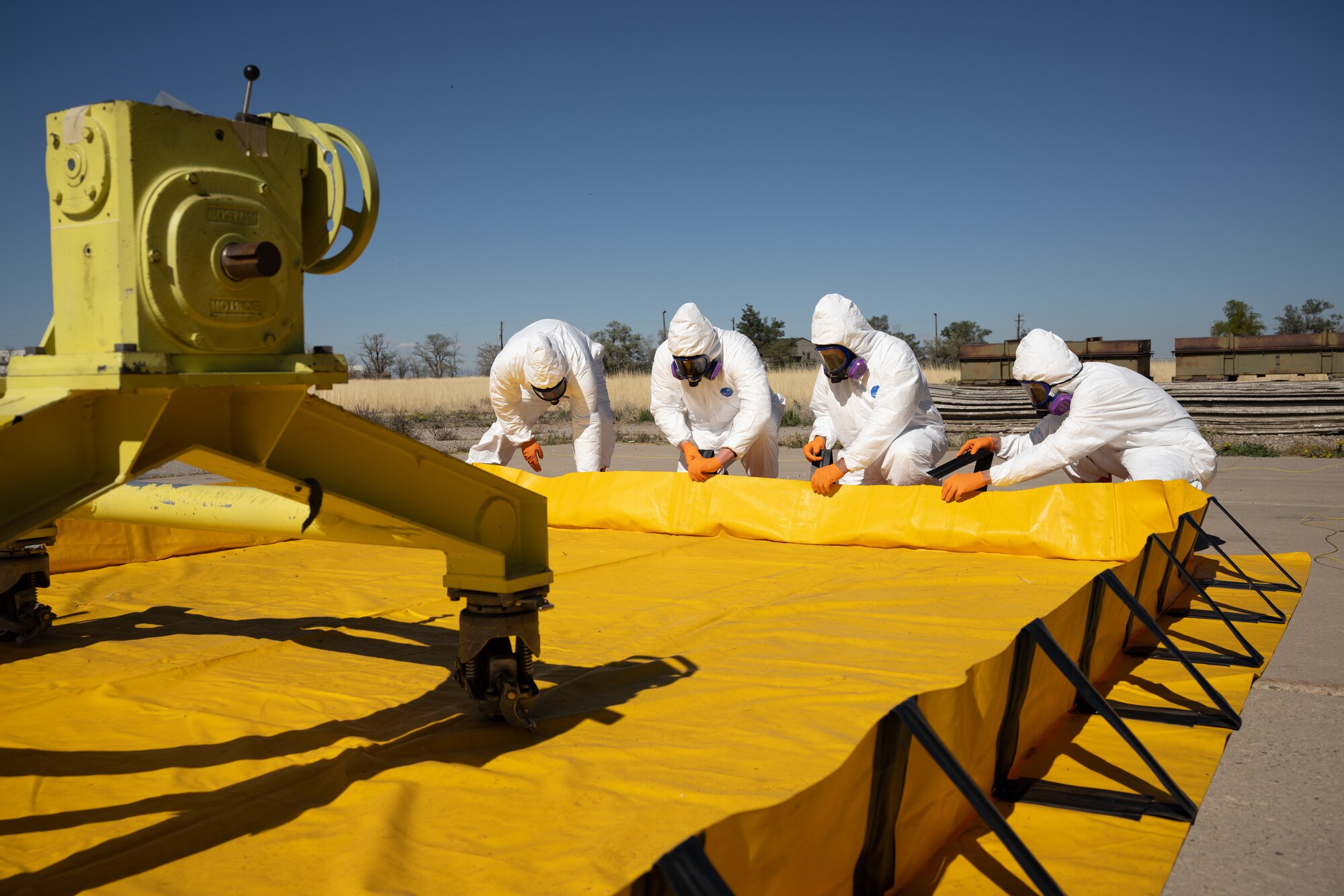 Members of the Missile Mishap Response Team erect a containment barrier during a training event at Hill Air Force Base, Utah, Oct. 4, 2022.