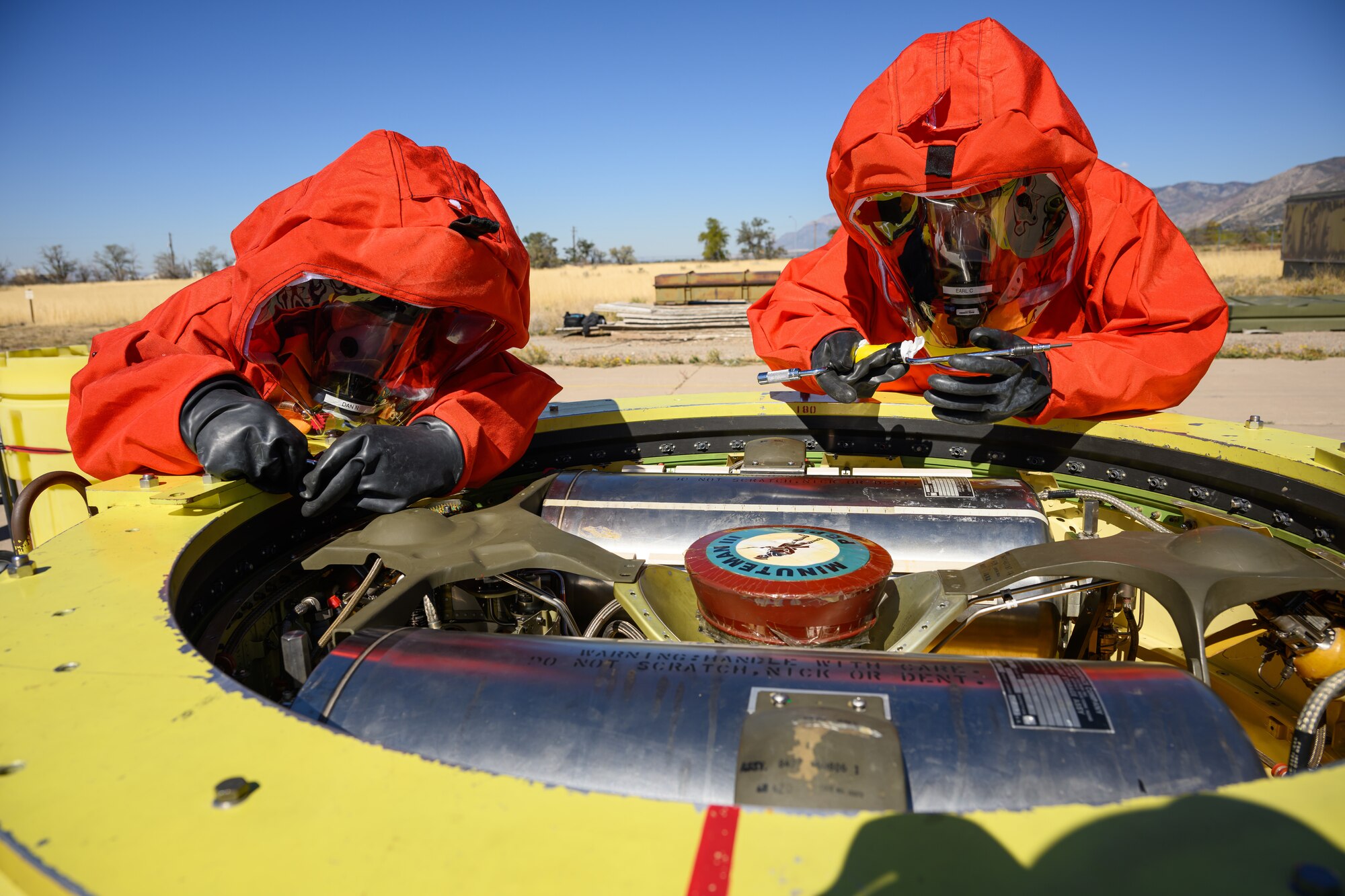 Members of the Missile Mishap Response Team work on a Minuteman III inert guidance system during a training event at Hill Air Force Base, Utah, Oct. 4, 2022.