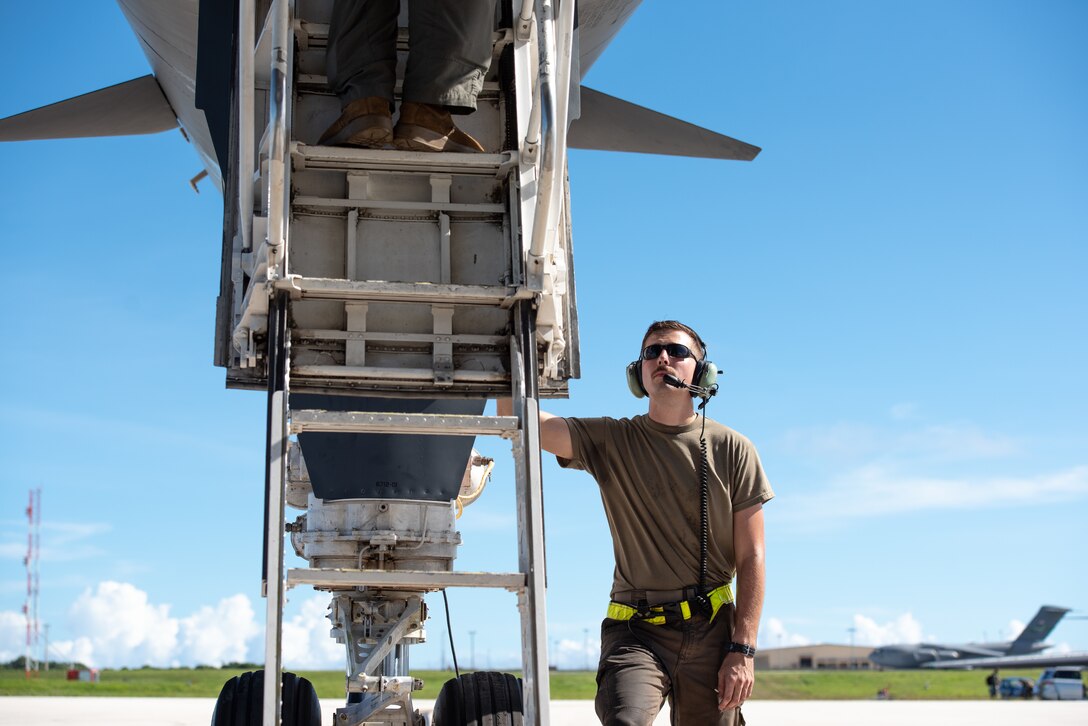 U.S. Air Force Senior Airman Jacob Szatkowski, 28th Aircraft Maintenance Squadron dedicated crew chief assigned to Ellsworth Air Force Base, South Dakota, oversees aircrew as they board a B-1B Lancer prior to a Bomber Task Force mission at Andersen AFB, Guam, Nov. 2, 2022.