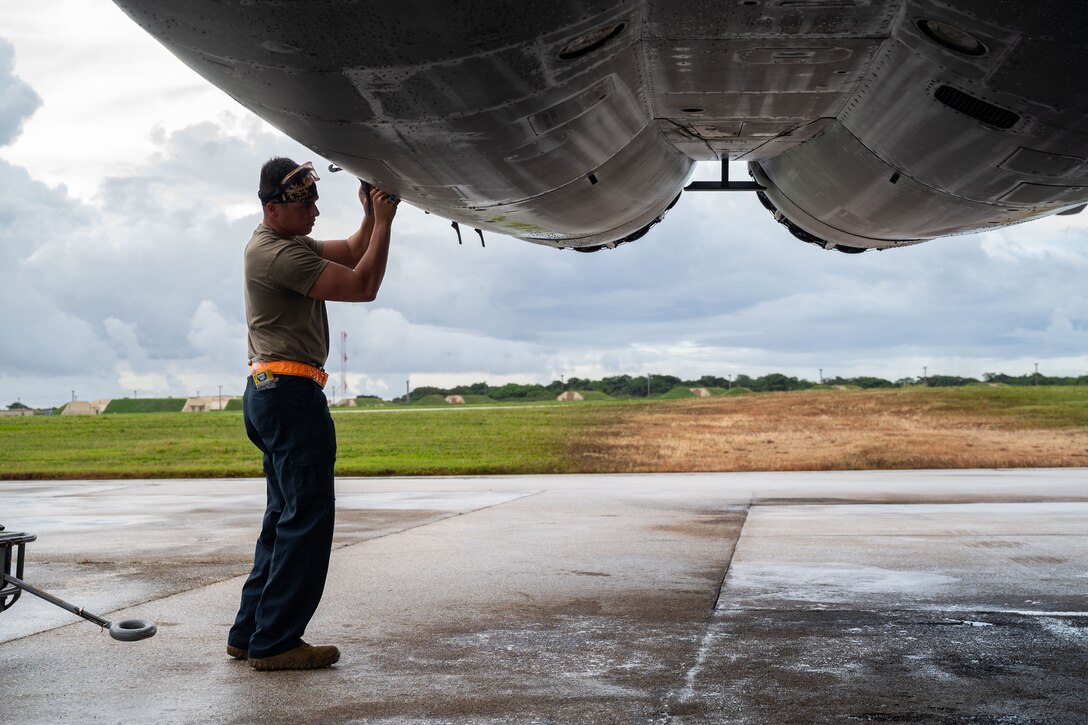 U.S Air Force Staff Sgt. James Nichols, 28th Aircraft Maintenance Squadron dedicated crew chief assigned to Ellsworth Air Force Base, South Dakota, opens the engine bay of a B-1B Lancer after a Bomber Task Force mission at Andersen AFB, Guam, Nov. 4, 2022. BTF missions demonstrate the credibility of our forces to address a complex and uncertain security environment. (U.S. Air Force photo by Staff Sgt. Hannah Malone)