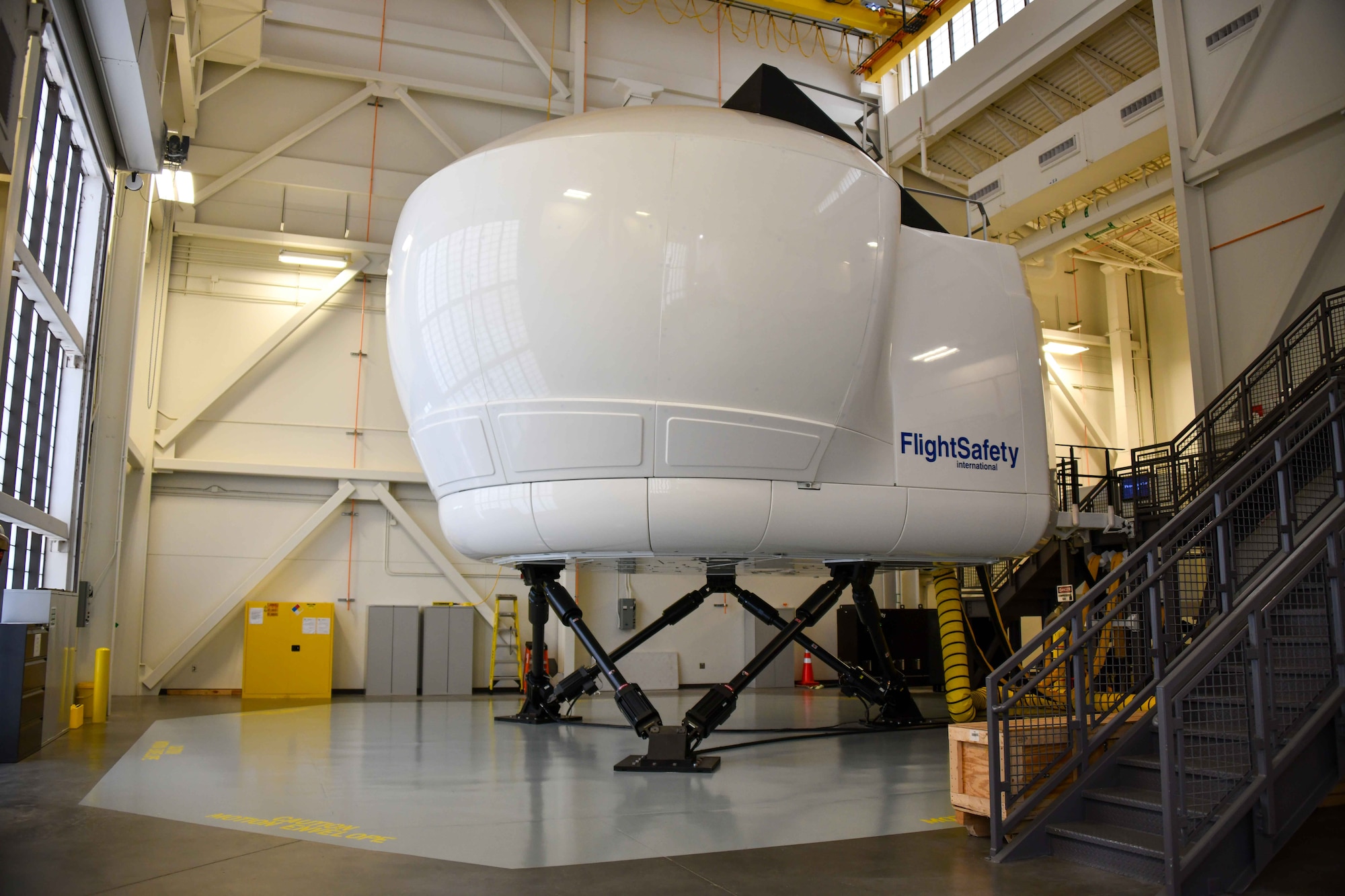 One KC-46 Pegasus pilot simulator in the schoolhouse at Altus Air Force Base, Oklahoma, November 2, 2022. The brand new simulators now make six in the whole schoolhouse, filling every warehouse space in the building. (U.S. Air Force photo by Airman 1st Class Kari Degraffenreed)