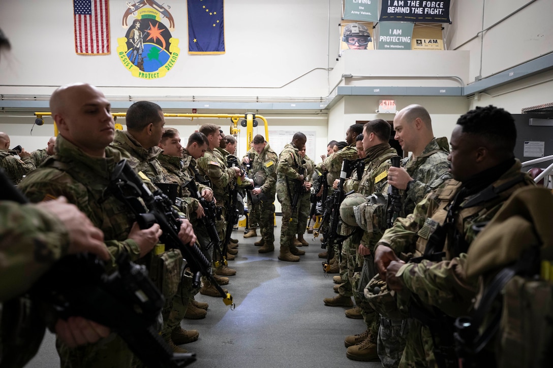 Squad leaders from 1st Platoon, Company A, 49th Missile Defense Battalion inspect their Soldiers before a shift changeover during Exercise Guardian Watch 23 at Fort Greely, Alaska, Nov. 1, 2022. Guardian Watch 23 focused on conducting ground-based midcourse Defense and critical installations security, which are the two missions of the 49th Missile Defense Battalion. (Alaska National Guard photo by Staff Sgt. Katie Mazos-Vega)